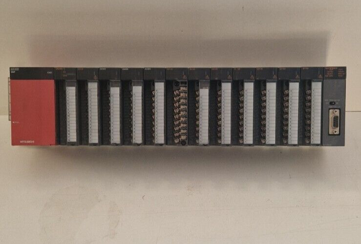 Mitsubishi Melsec-Q rack with QX80, QY10, Q64RD, Q62P, QJ7 1PB92D. For Parts